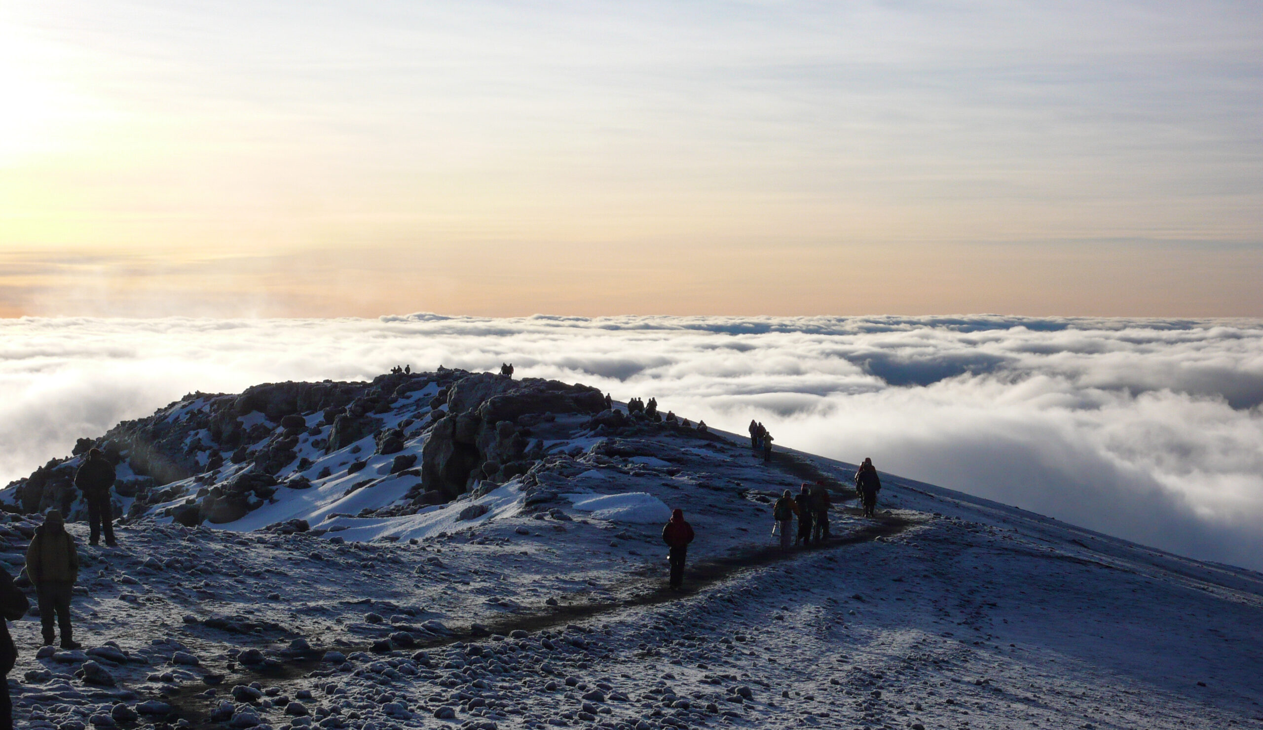 Climbers on the summit glaciers of Mount Kilimanjaro at sunrise